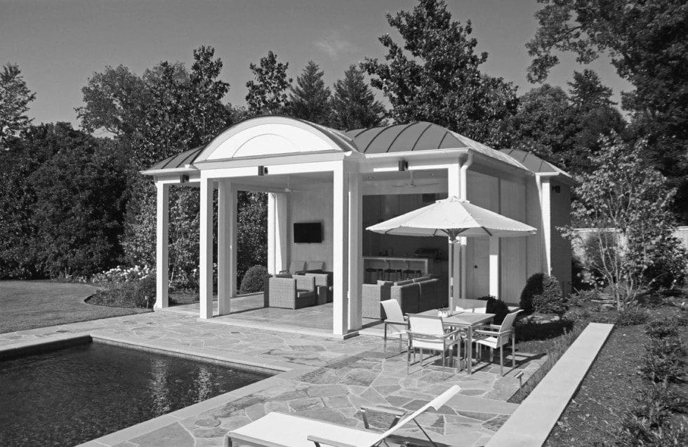 A black and white photo of an outdoor living space.