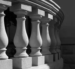 A close up of some pillars on the side of a building