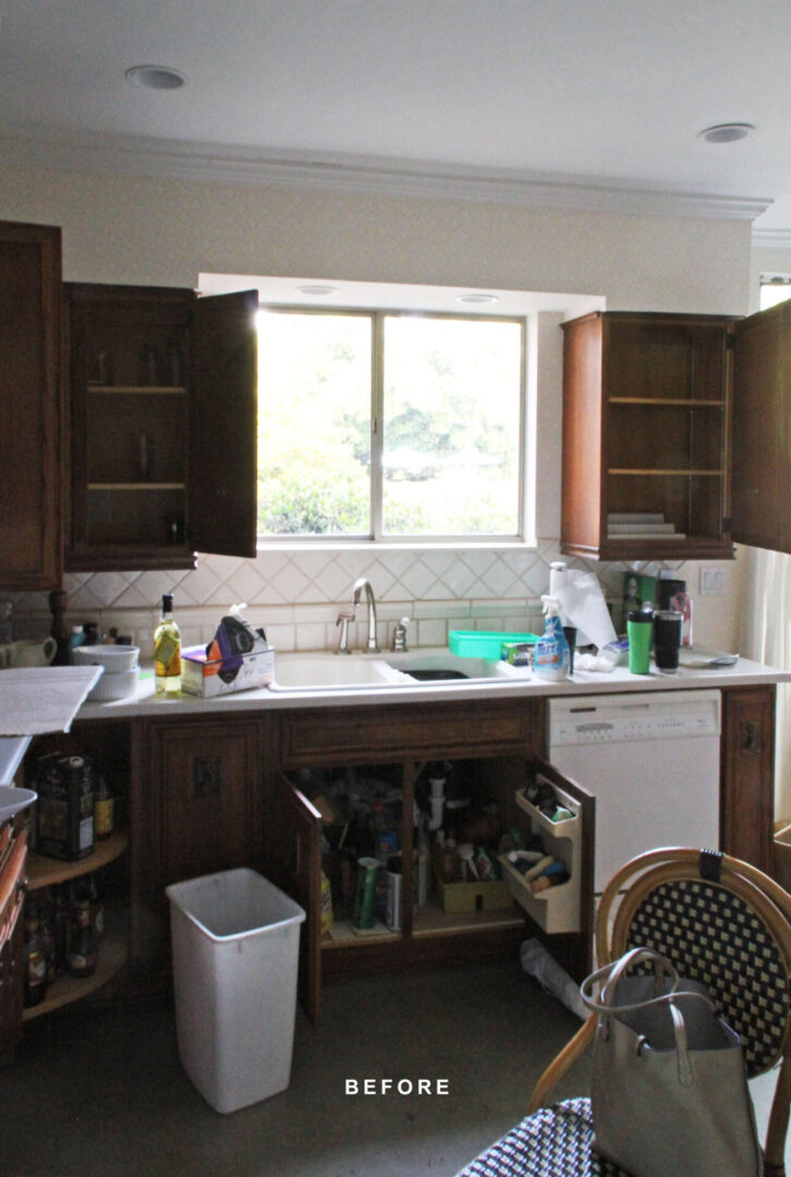 A kitchen with brown cabinets and white appliances.