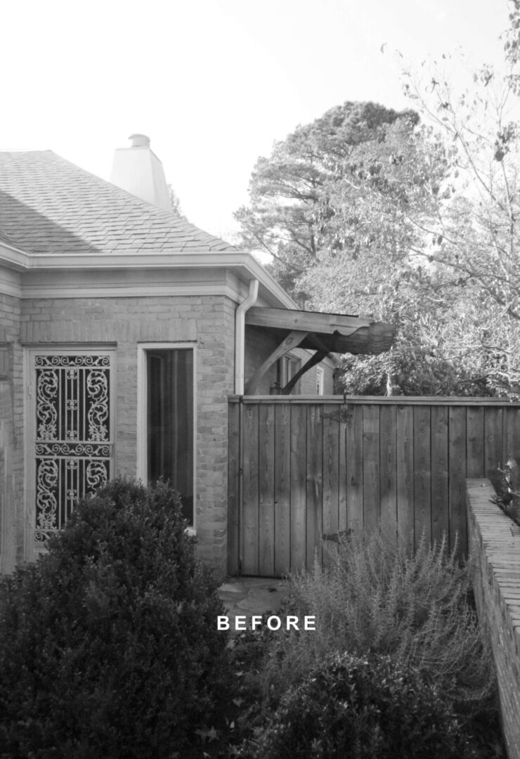 A black and white photo of an old house