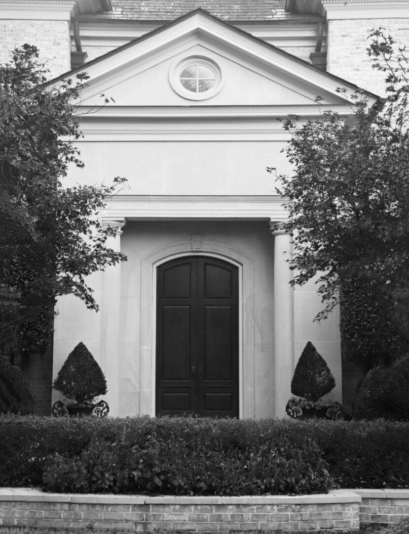 A black and white photo of an old church.