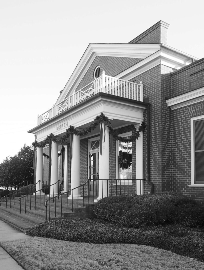 A black and white photo of the front entrance to a building.