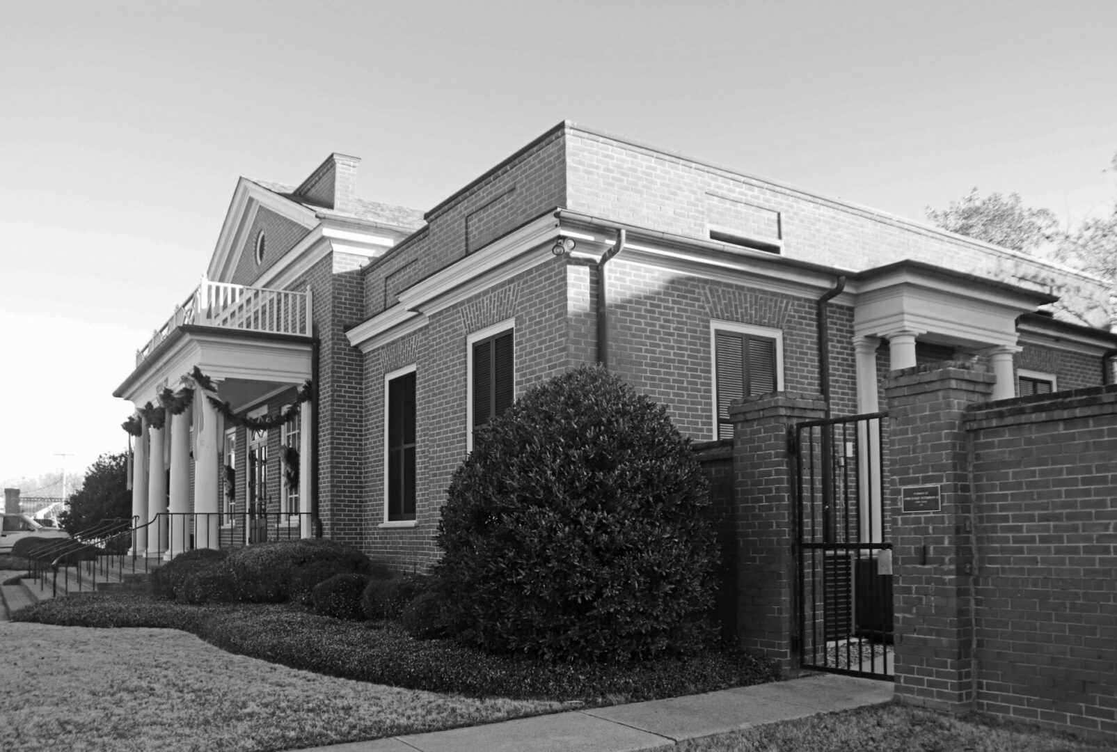 A black and white photo of the front entrance to a building.