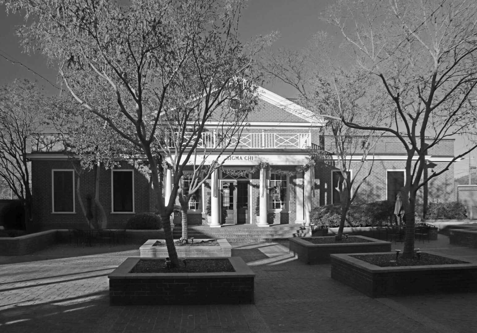 A black and white photo of the front entrance to a building.