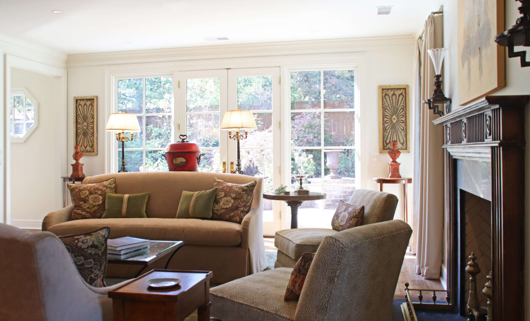 A living room with two chairs and a couch