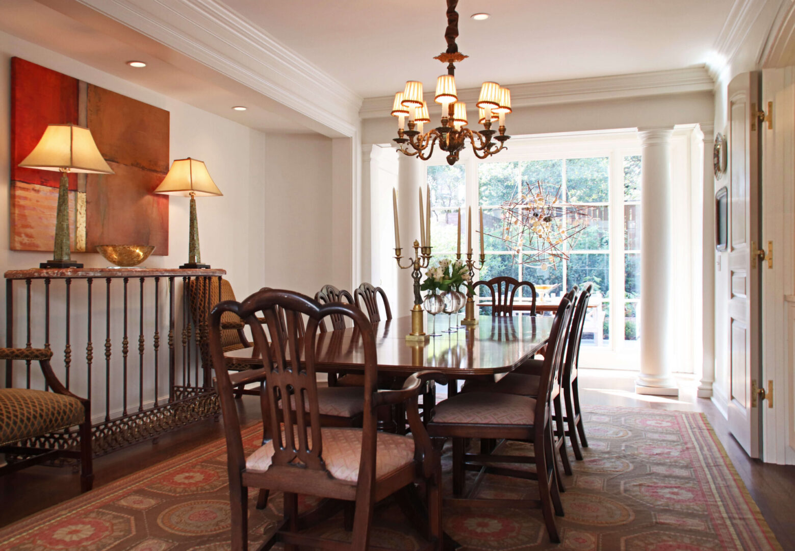 A dining room table with chairs around it