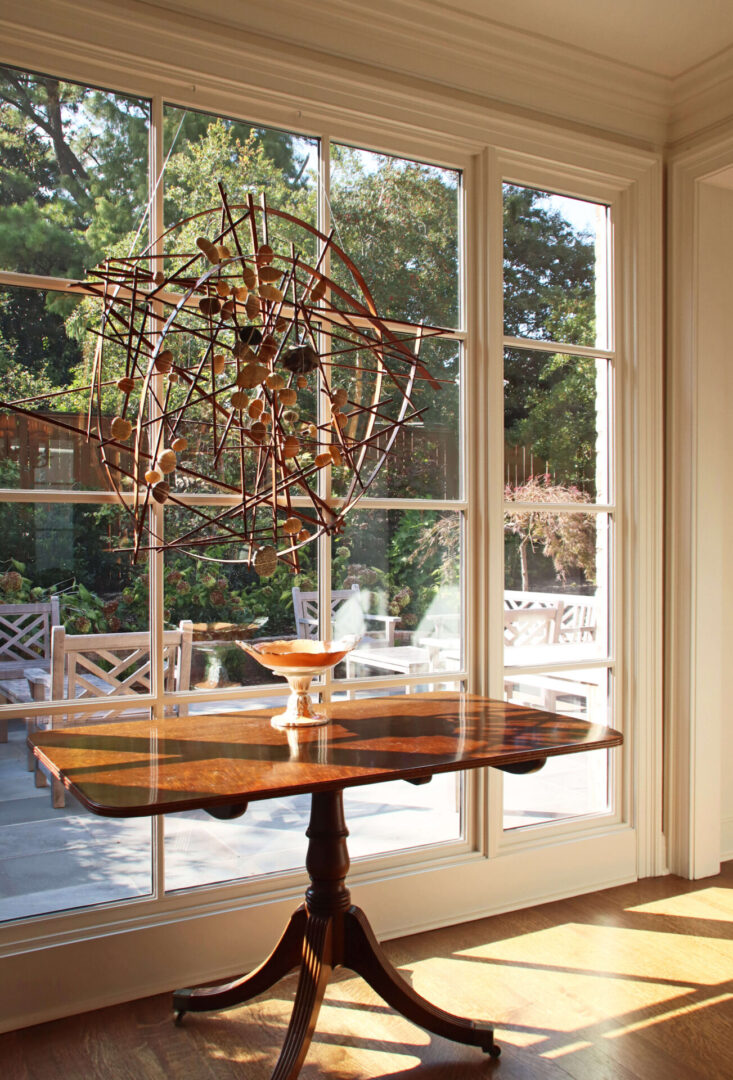 A table in front of a window with a view outside.