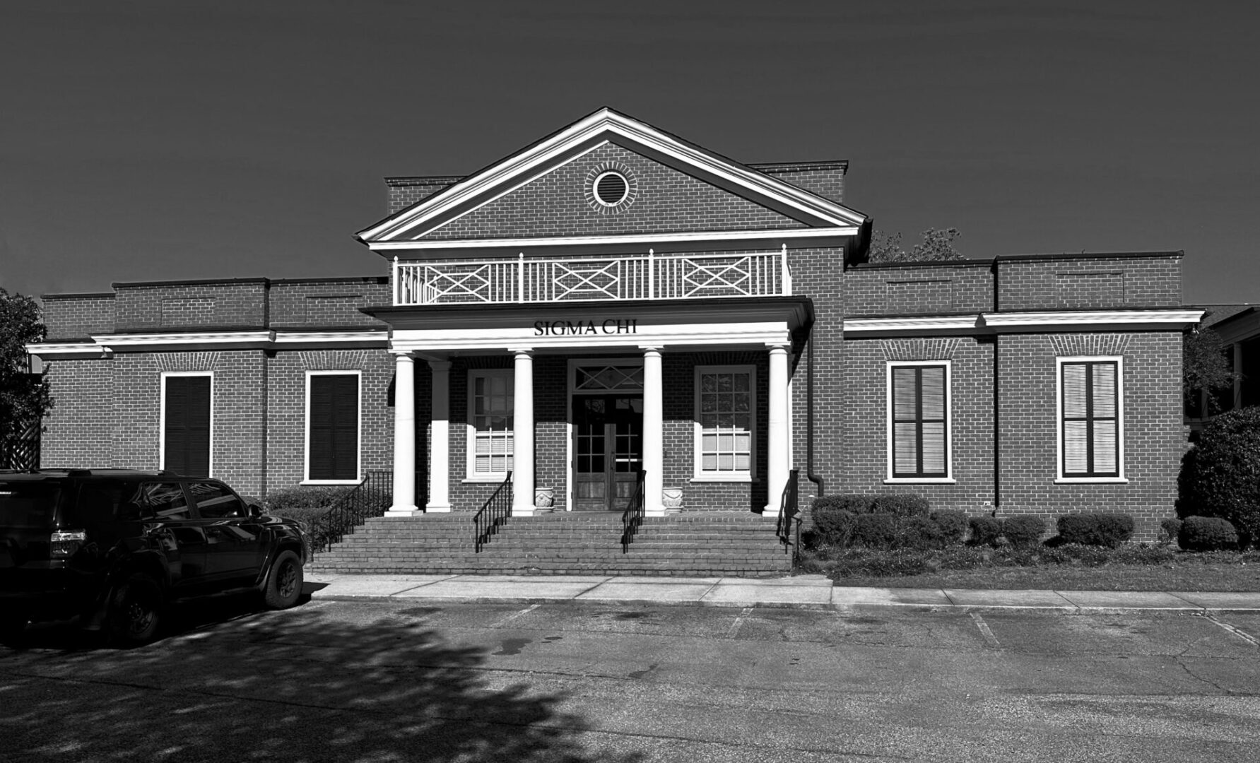 A black and white photo of an old building.