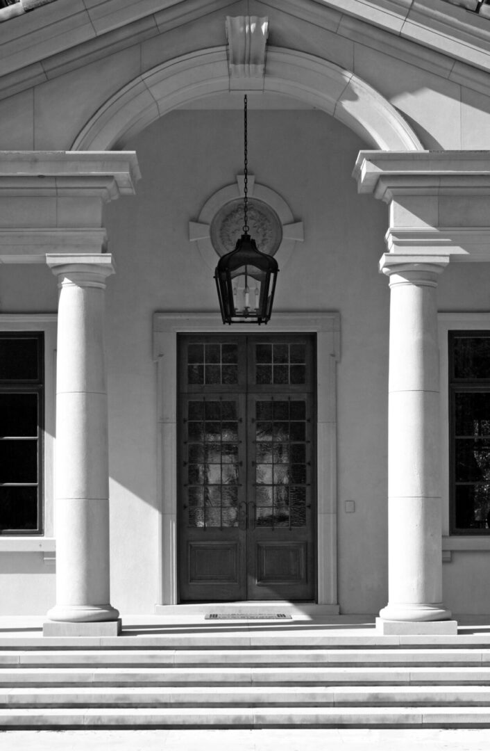 A black and white photo of an entrance to a building.