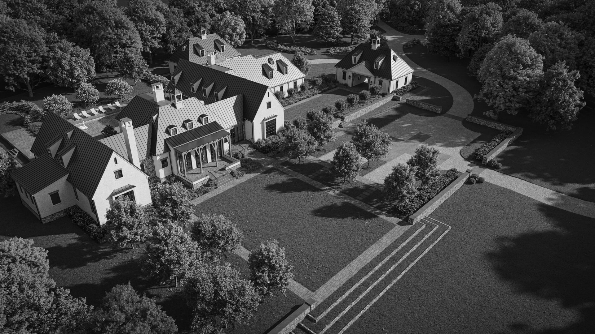 An aerial view of a house with trees in the background.