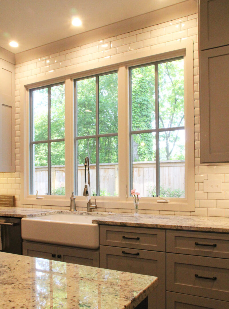 A kitchen with a sink and window in it