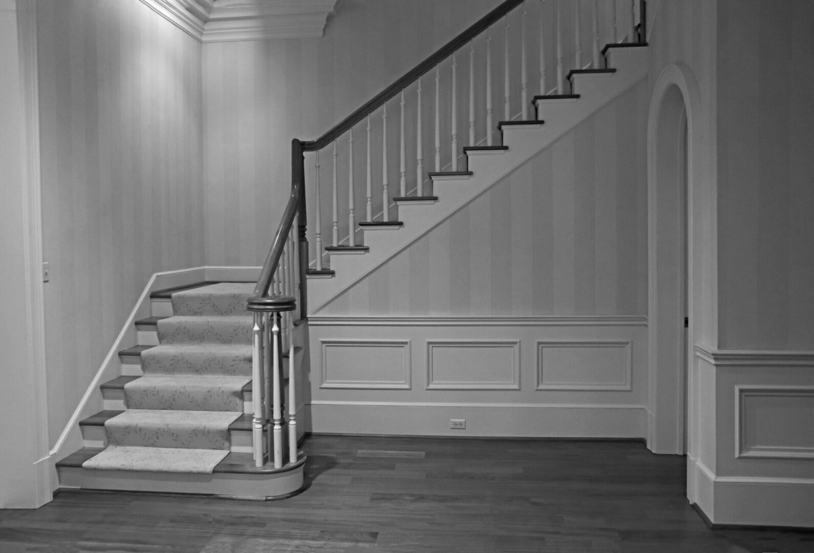 A black and white photo of a staircase.