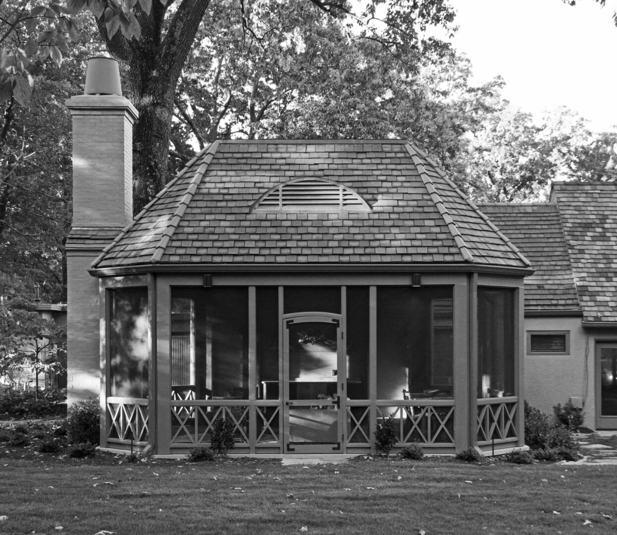 A black and white photo of an old house.