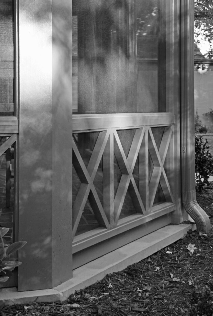 A black and white photo of an old window.