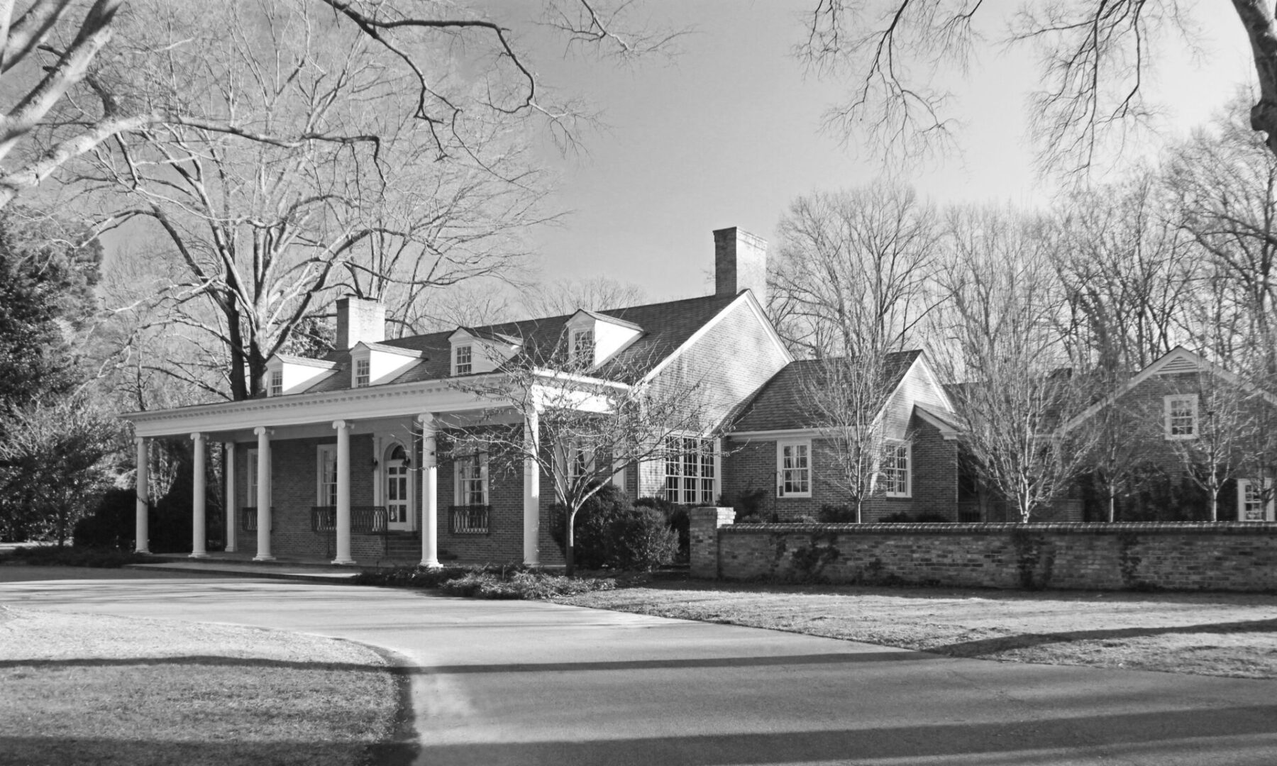 A black and white photo of an old house.