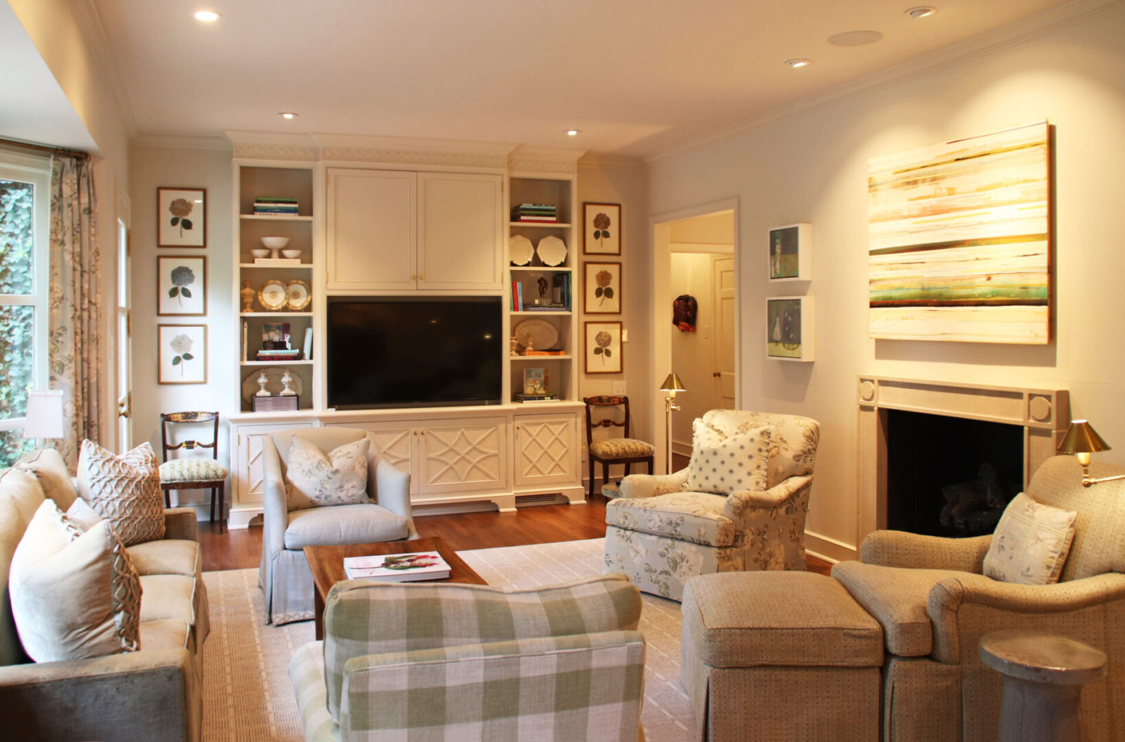 A living room with furniture and a television.