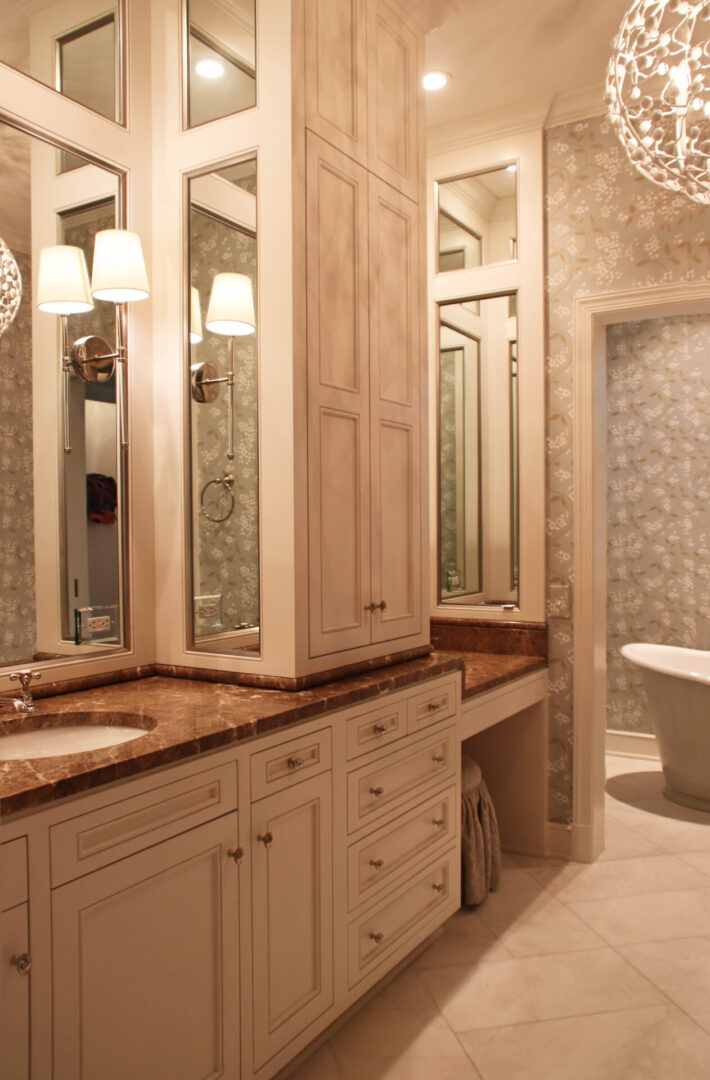 A bathroom with two sinks and a large mirror.