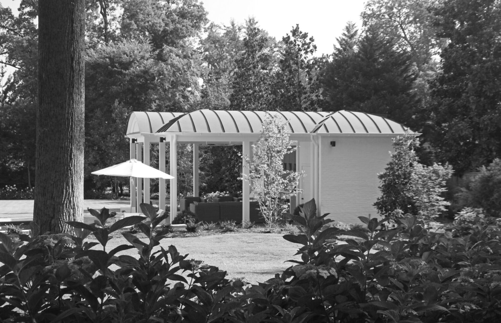 A black and white photo of a small house.