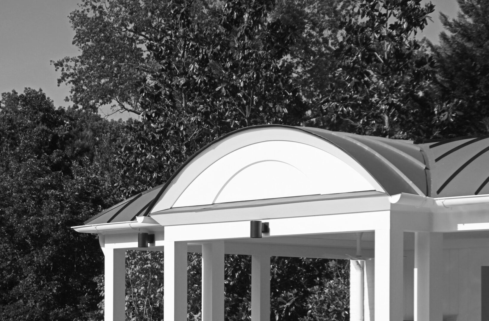 A black and white photo of an outdoor structure.