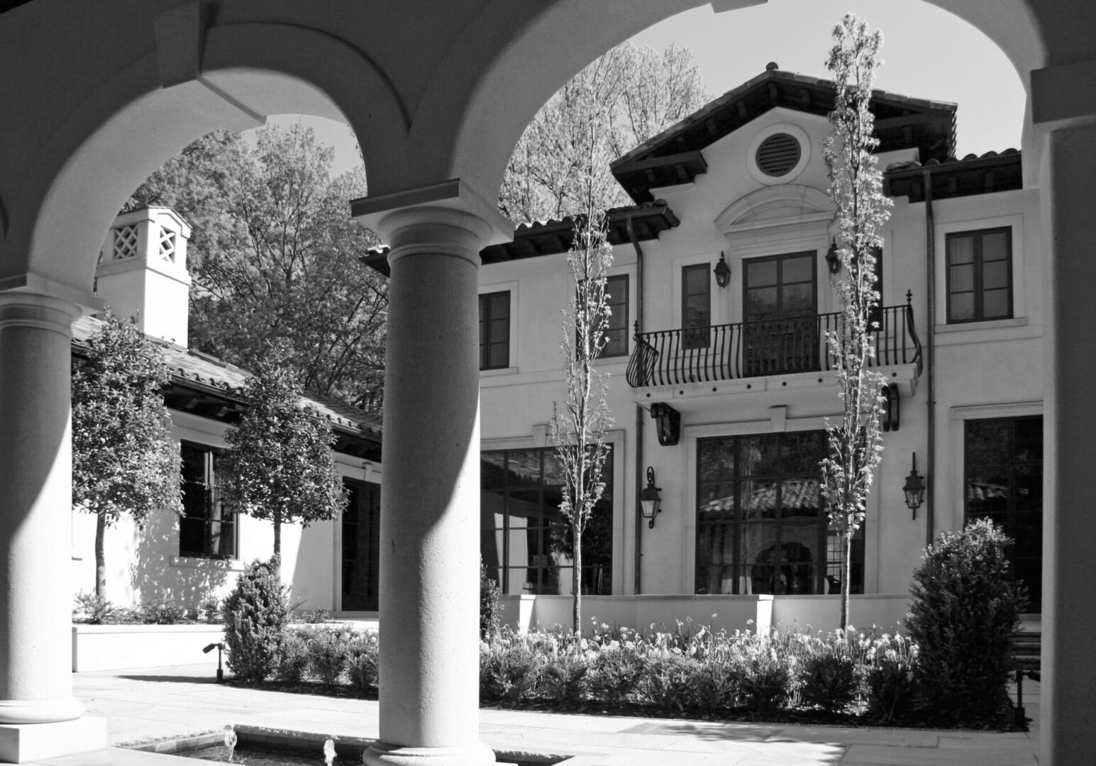 A black and white photo of an old style building.