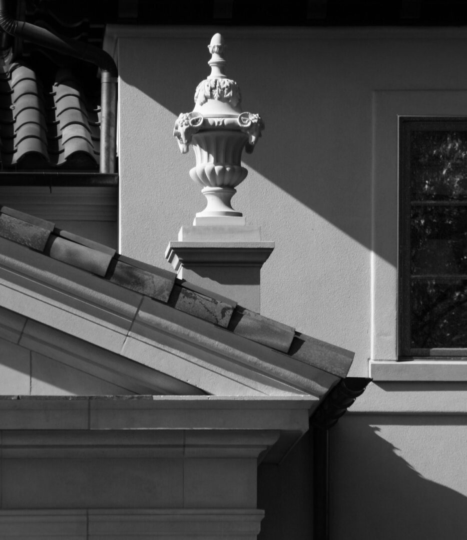 A building with a statue on the top of it.