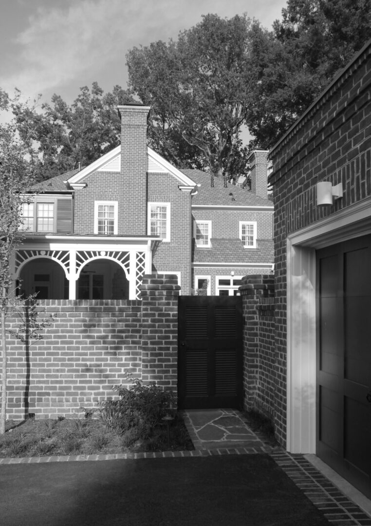 A black and white photo of an old house.