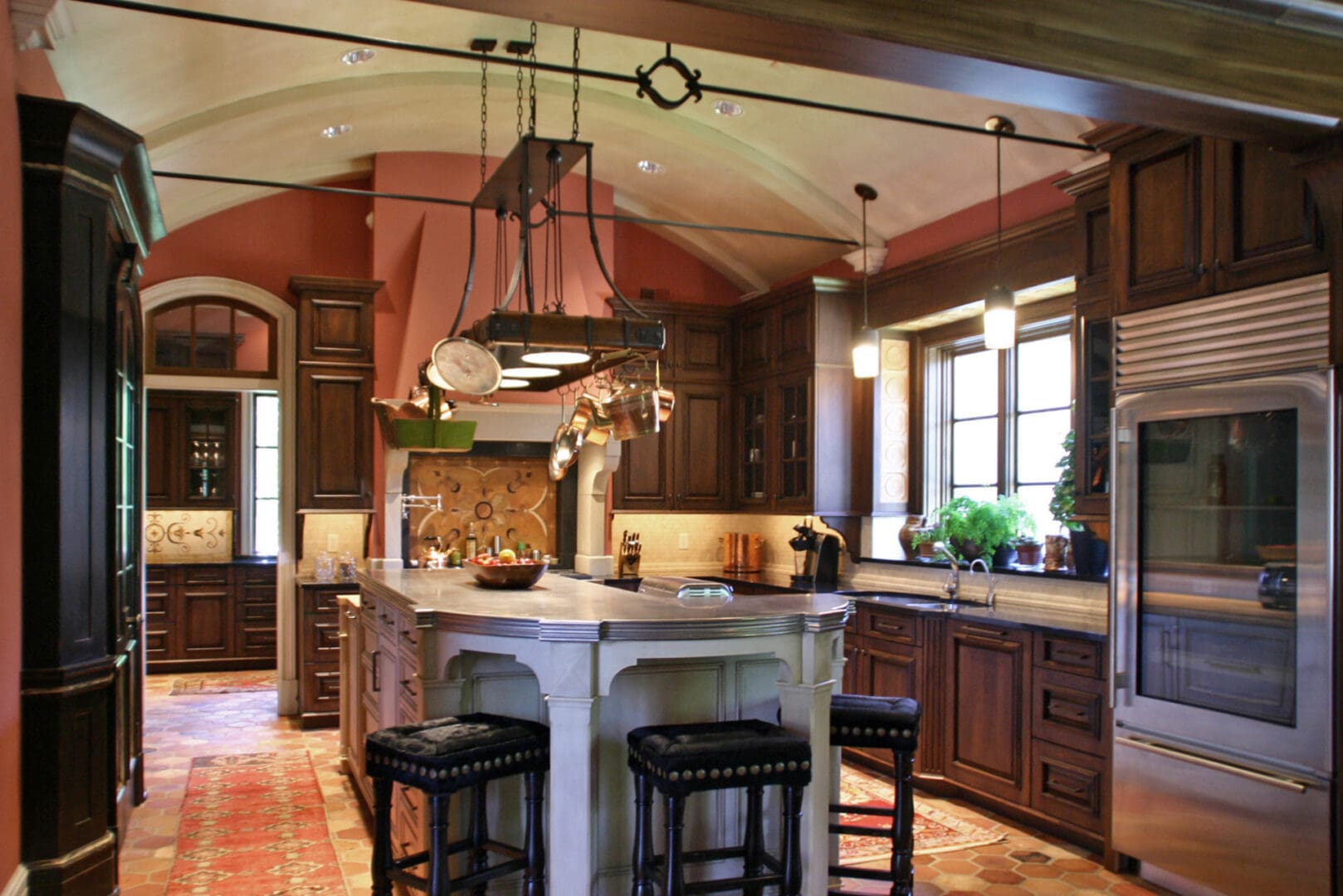 A kitchen with a large island and wooden cabinets.