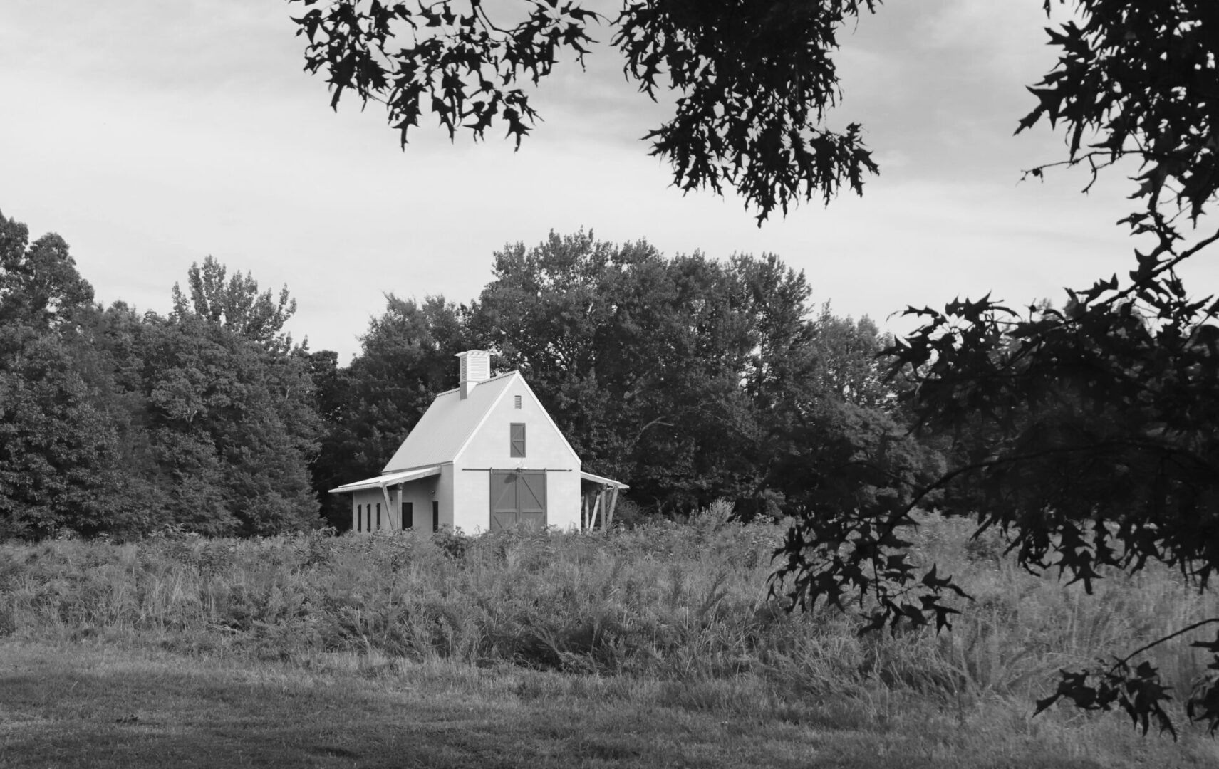 A small white house in the middle of nowhere.