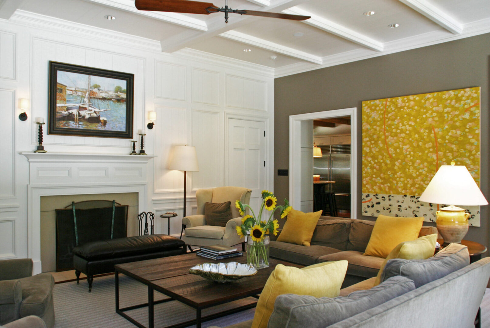 A living room with yellow and gray decor