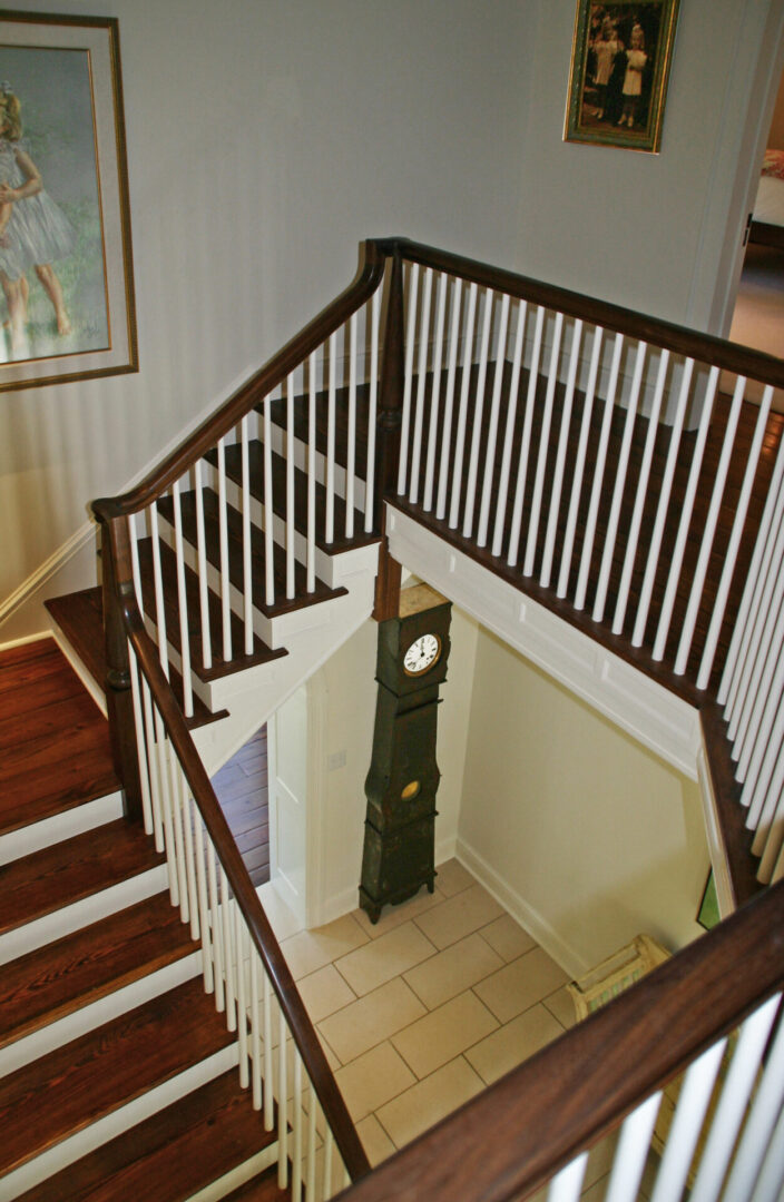 A staircase with a clock and stairs in it