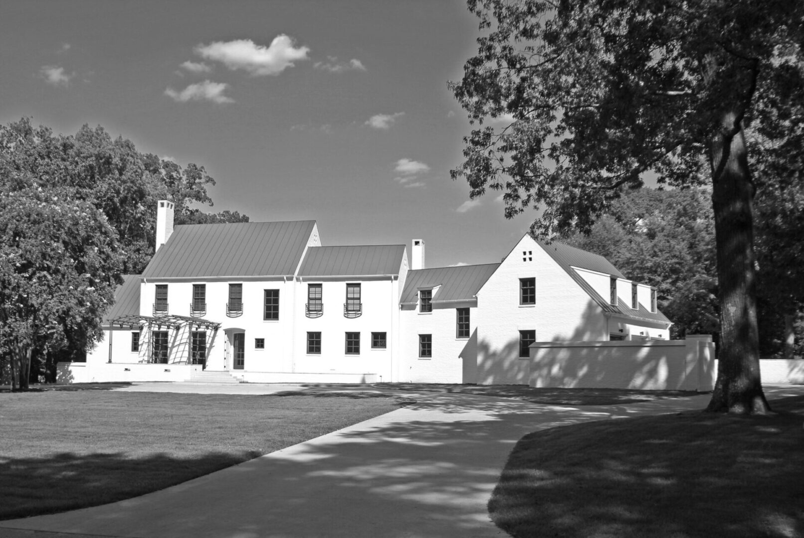 A black and white photo of an old house.