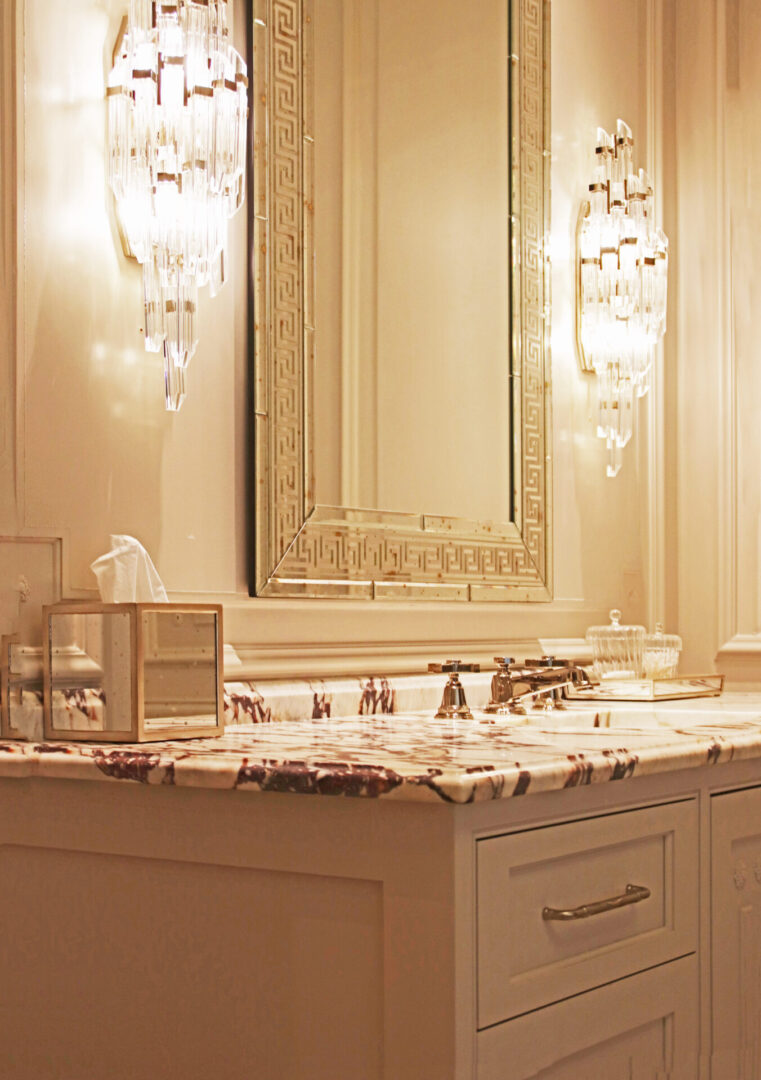 A bathroom with a large mirror and vanity.