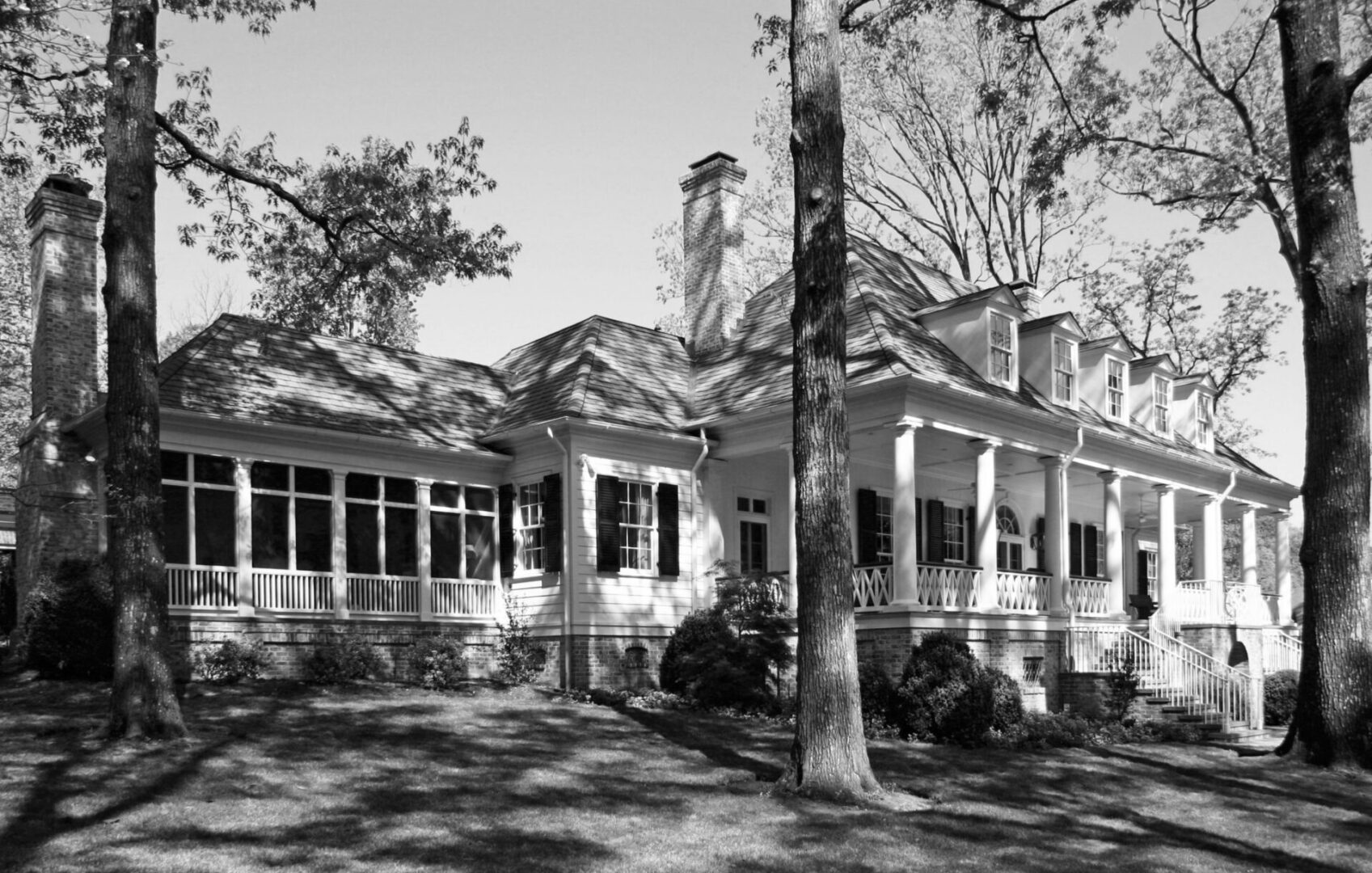 A black and white photo of an old house.