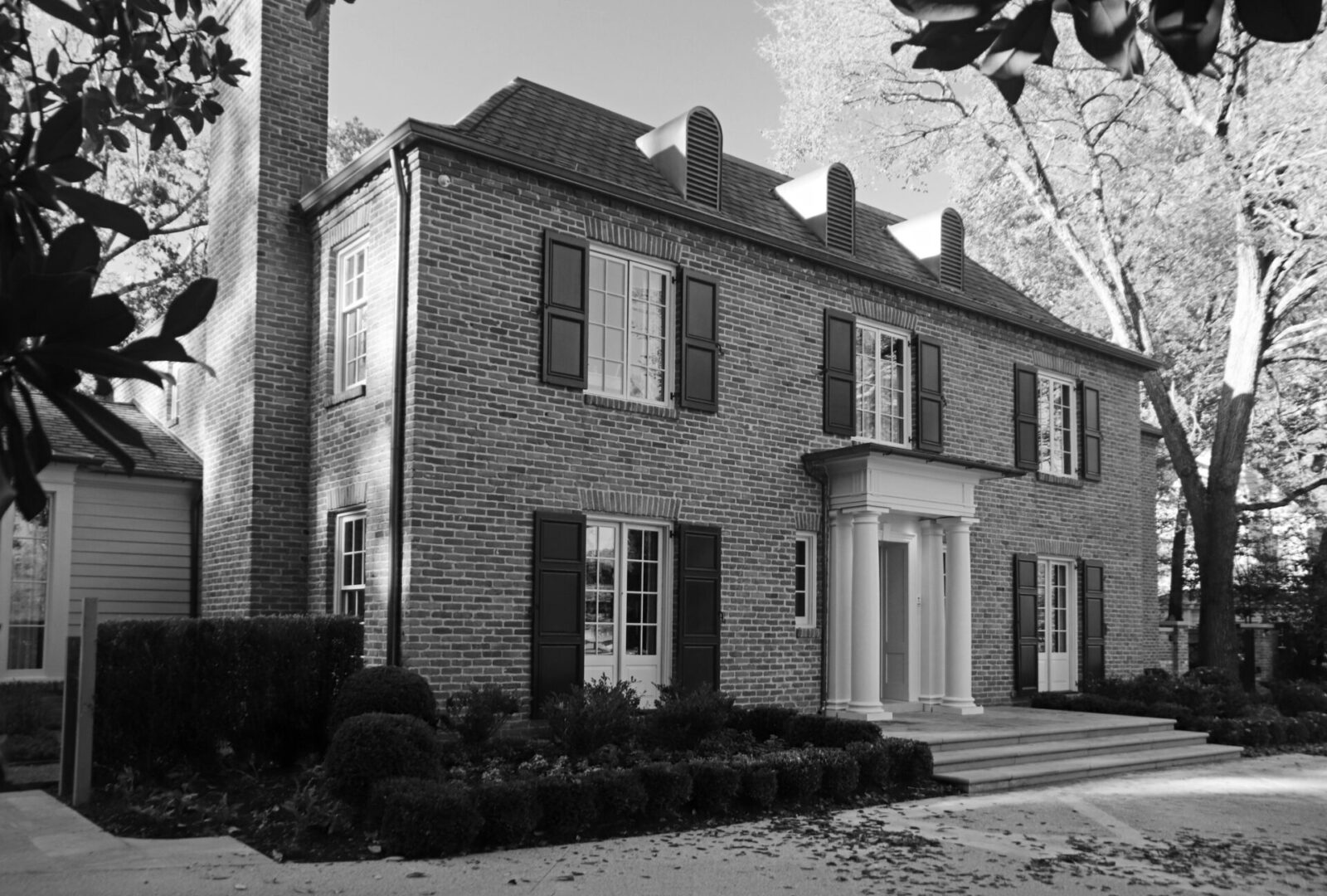 A black and white photo of American Georgian home.