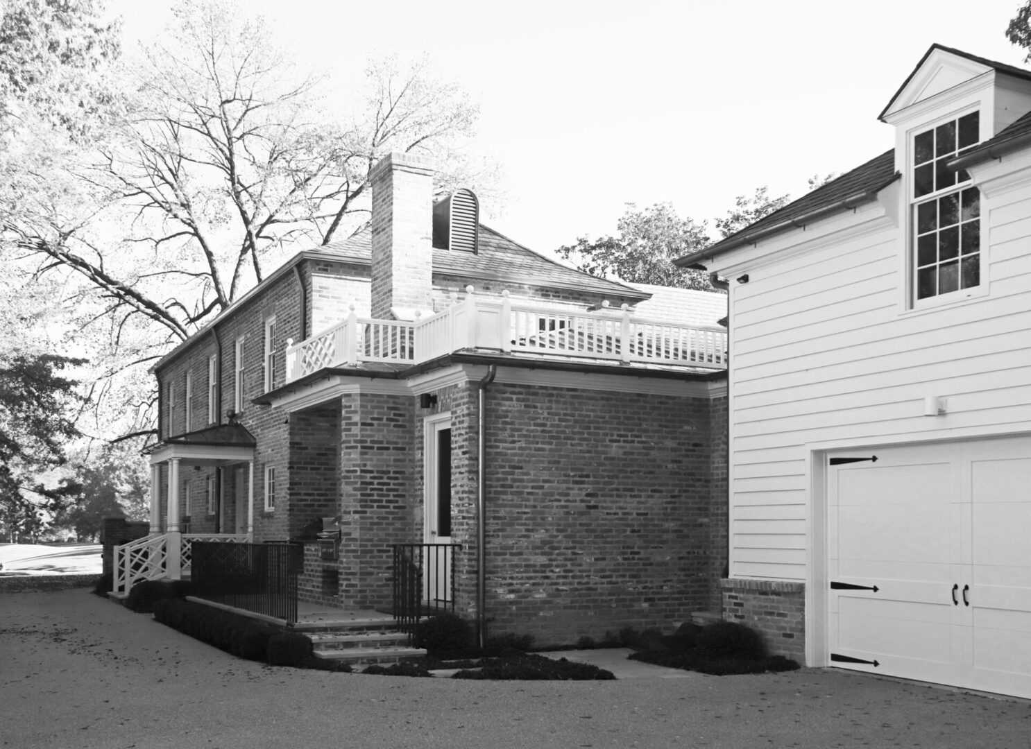 A black and white photo of American Georgian home