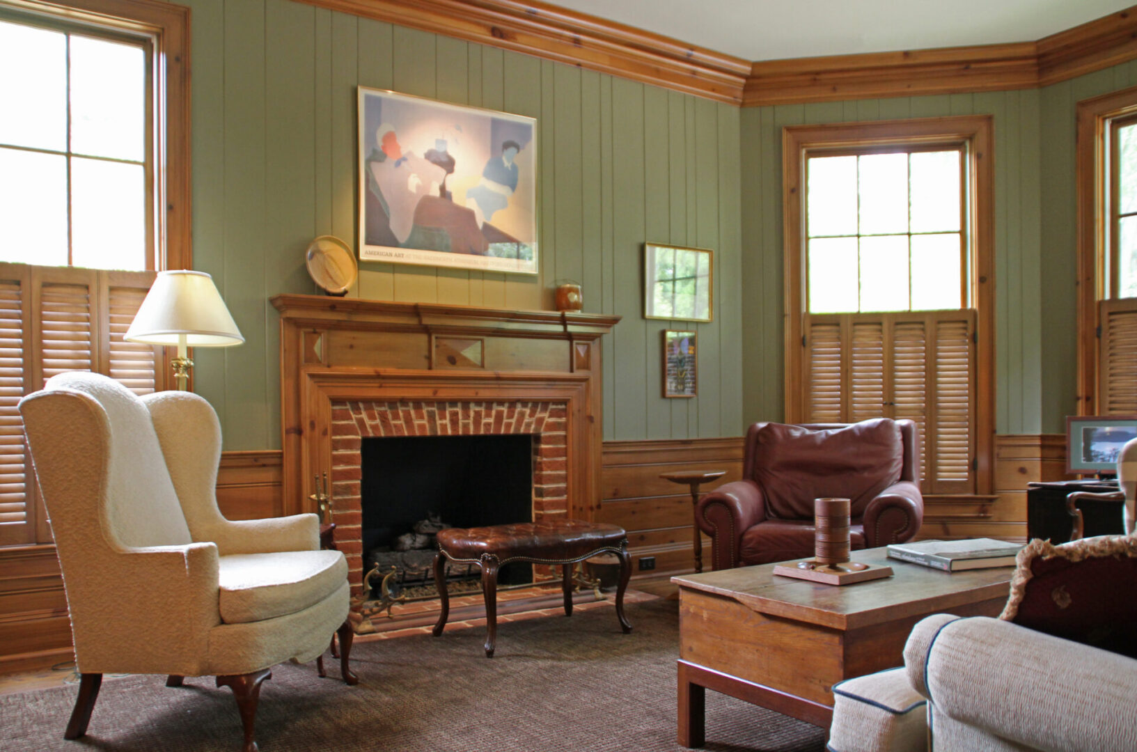 A living room with furniture and a fireplace.