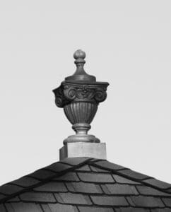 A black and white photo of the top of a building.