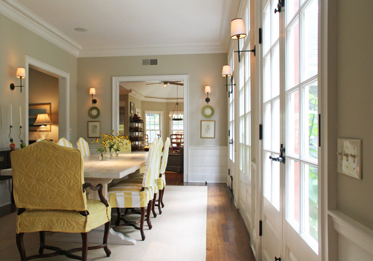 A Georgetown Federal dining room with yellow chairs and white table.