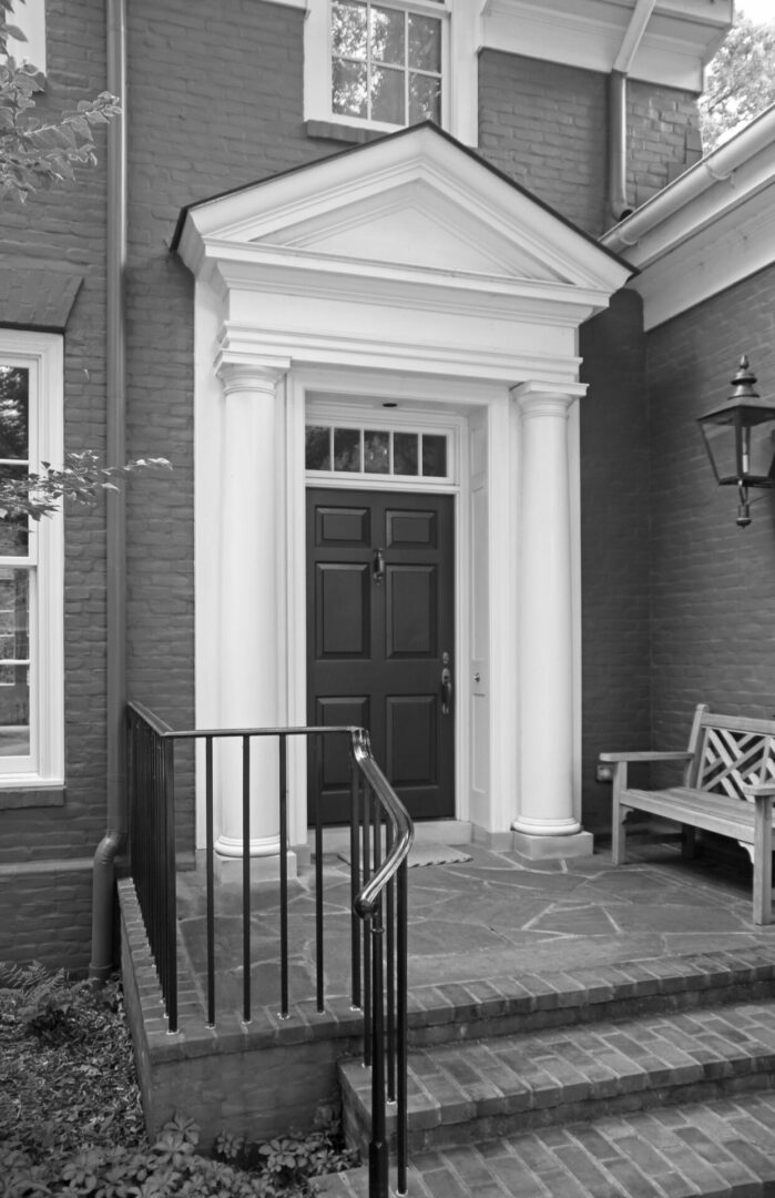 A black and white photo of an entrance to a building.