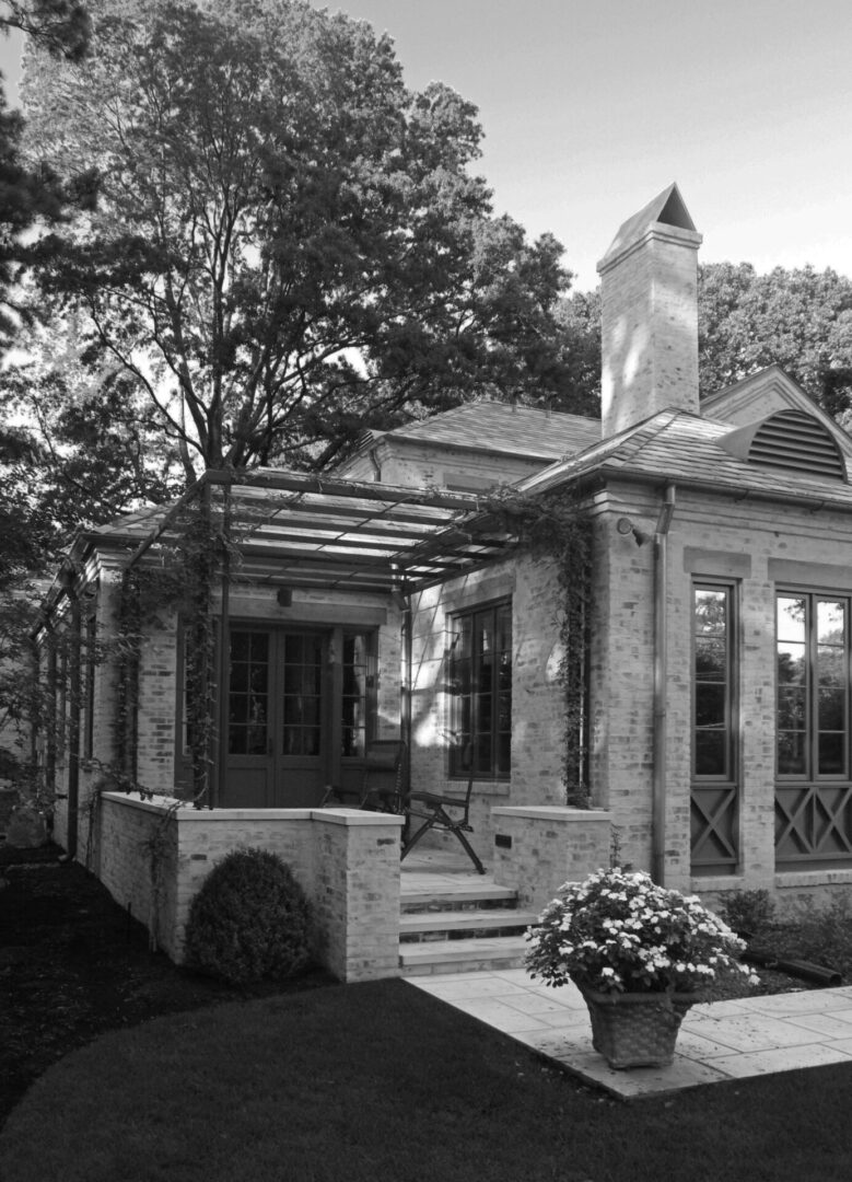 A black and white photo of an old house.