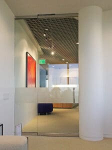 A hallway with a red painting on the wall.