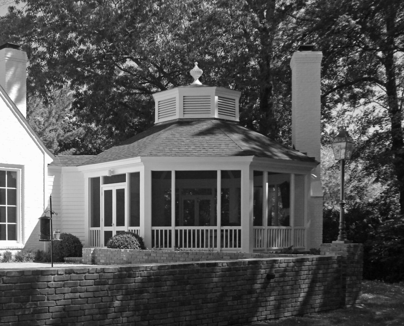 A black and white photo of a gazebo.