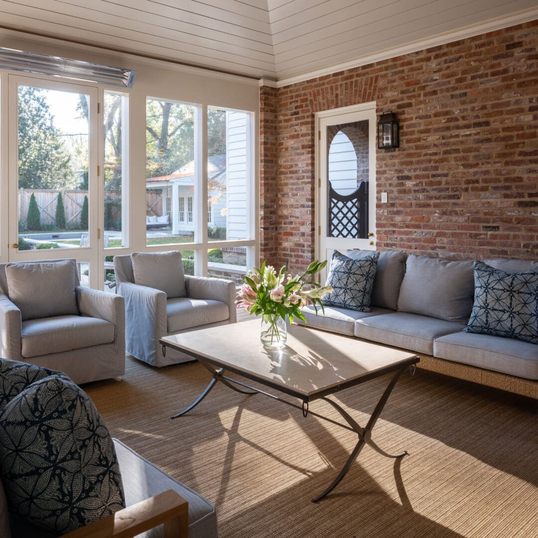 A living room with couches and tables in it